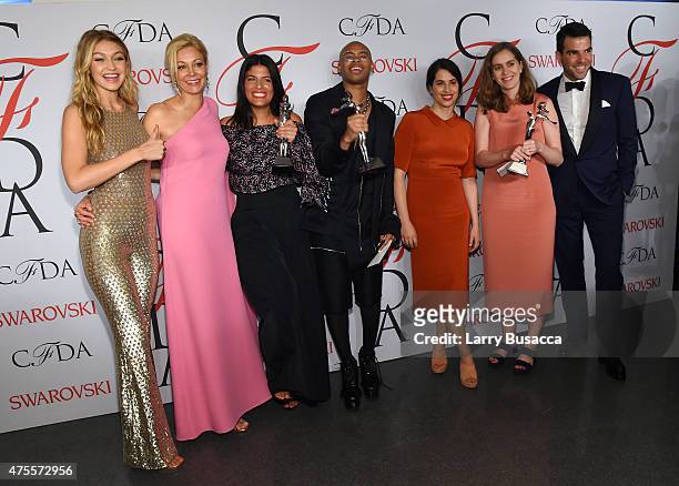 Gigi Hadid, Nadja Swarovski, Rosie Assoulin, Shayne Oliver, Floriana Gavriel, Rachel Mansur and Zachary Quinto pose on the winners walk at the 2015...
