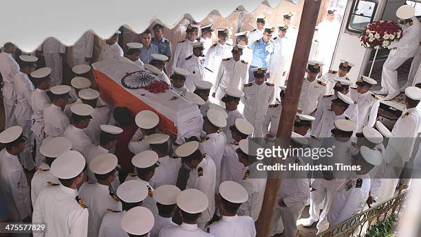 Indian Navy personal carry coffin of Lieutenant Commander Kapish Muwal during his funeral at Chandanwadi Crematorium at Marine Lines on February 28,...