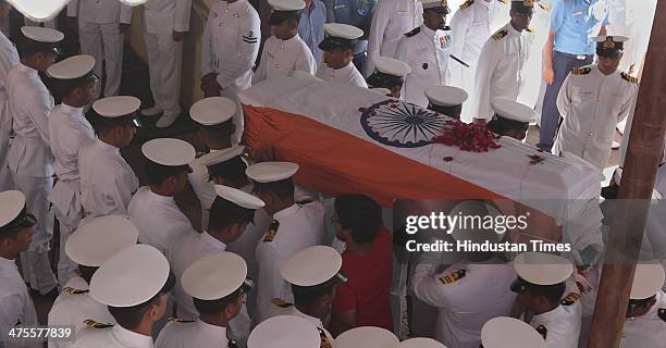 Indian Navy personal carry coffin of Lieutenant Commander Kapish Muwal during his funeral at Chandanwadi Crematorium at Marine Lines on February 28,...