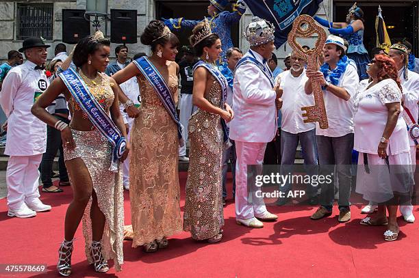 King Momo Wilson Dias da Costa Neto receives the key to the city from Rio de Janeiro's Mayor Eduardo Paes during the official opening of the world...