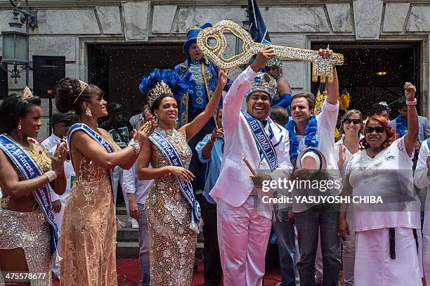 King Momo Wilson Dias da Costa Neto receives the keys to the city from Rio de Janeiro Mayor Eduardo Paes during the official opening of the world...