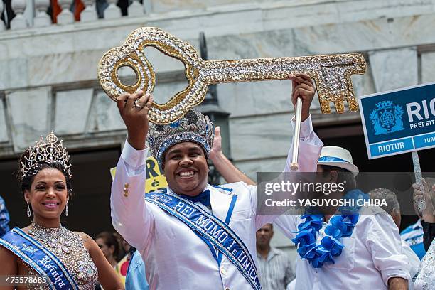 King Momo Wilson Dias da Costa Neto receives the key to the city with Queen Leticia Martins Guimaraes during the official opening of the world famous...