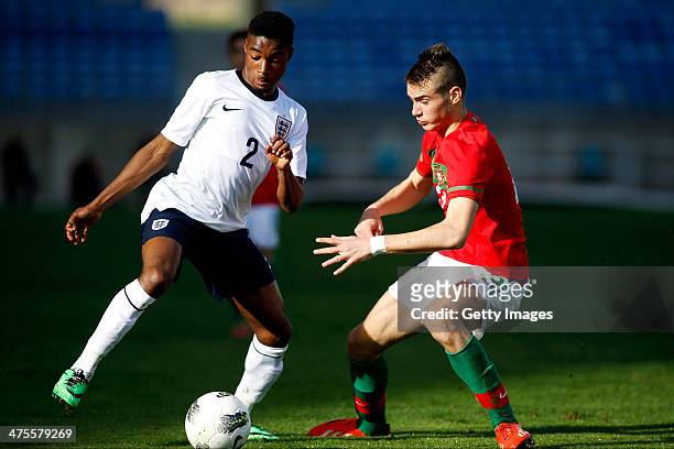 Mandela Egbo of England challenges Ferro of Portugal during the Under17 Algarve Cup match between U17 Portugal and U17 England at Parque des Cidades...