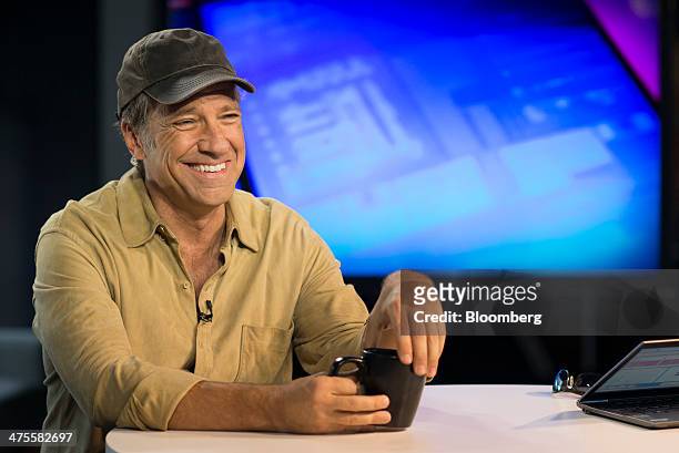 Michael "Mike" Rowe, former host of "Dirty Jobs", smiles during a Bloomberg West Television interview in San Francisco, California, U.S., on...