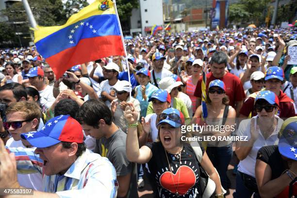 Anti-government demonstrators protest in eastern Caracas on February 28, 2014. The death toll from more than three weeks of political unrest in...