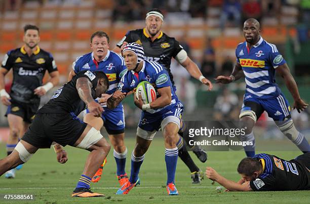 Gio Aplon of the Stormers in action during the Super Rugby match between DHL Stormers and Hurricanes at DHL Newlands Stadium on February 28, 2014 in...