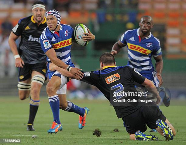 Gio Aplon of the Stormers in action during the Super Rugby match between DHL Stormers and Hurricanes at DHL Newlands Stadium on February 28, 2014 in...