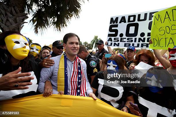 Senator Marco Rubio stands with supporters of the Venezuela opposition on February 28, 2014 in Doral, Florida. Rubio and Florida Governor Rick Scott...