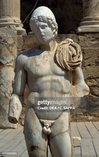 Statue of Hercules near the The stage in the Theatre , Roman city of Leptis Magna , Tripoli, Libya. Roman civilisation.