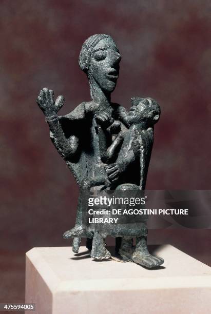 Woman with child, bronze statue. Nuragic civilisation, 5th-8th century BC. Cagliari, Museo Archeologico Nazionale