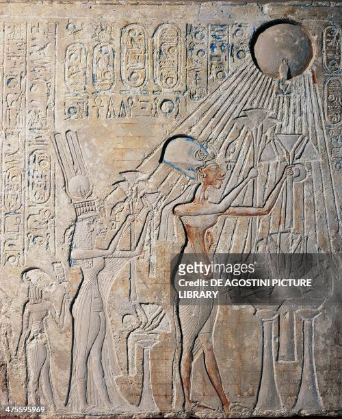 Stele depicting Akhenaten with Nefertiti and their daughters bearing offerings to Aton, limestone, from Tell el-Amarna. Egyptian civilisation, New...