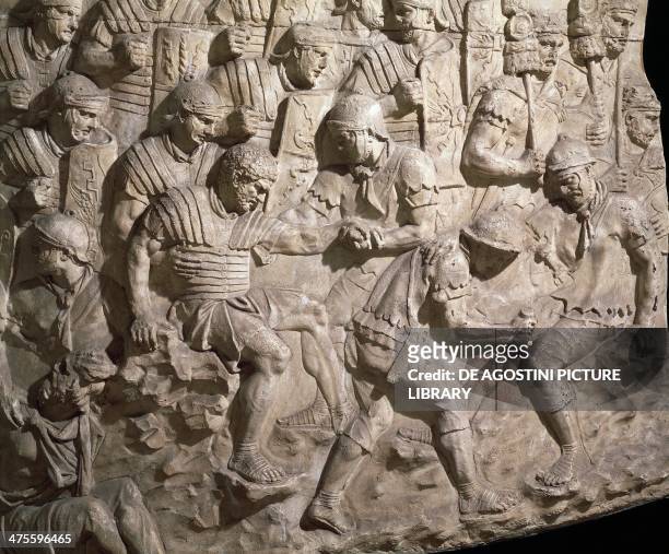 Soldiers aiding their wounded comrades after a battle against the Dacians, plaster cast, relief of Trajan's Column. Detail. Roman civilisation, 2nd...