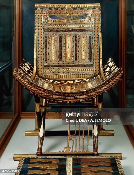 Ceremonial throne and footstool, from the Tomb of Tutankhamun, Thebes, Egypt. Egyptian civilisation, New Kingdom, Dynasty XVIII. Cairo, Egyptian...