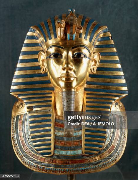 Funerary mask of Tutankhamun, beaten gold, ceramic and semi-precious stones, from the Tomb of Tutankhamun, Thebes, Egypt. Goldsmith art, Egyptian...