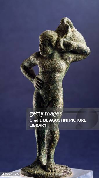 Ethiopian carrying a wine-making amphora, bronze sculpture. Etruscan civilisation, 6th-5th century BC. Marzabotto, Museo Nazionale Etrusco Pompeo Aria