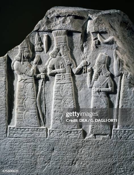 Stele with inscription and relief depicting Shamsh-Res- usur, governor of Mari and Suhi, praying to the gods Baal and Ishtar, Babylon, Iraq....