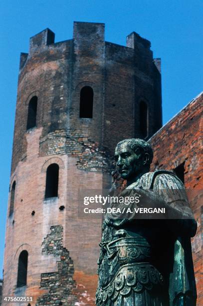One of the polygonal towers and statue of Julius Caesar, Porta Palatina, Turin, Piedmont, Italy. Roman civilisation, 1st century BC.