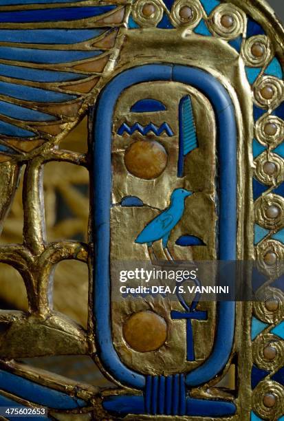 Cartouche, detail from the decoration on the throne of Tutankhamun, in wood, gold leaf, silver, glass gems and precious stones, from the Tomb of...