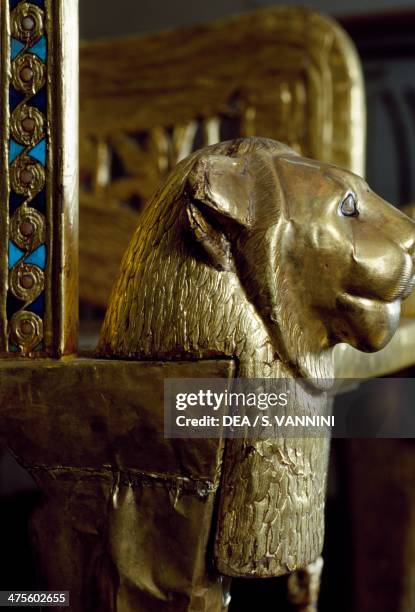 Lion head, detail from the decoration on the throne of Tutankhamun, in wood, gold leaf, silver, glass gems and precious stones, from the Tomb of...