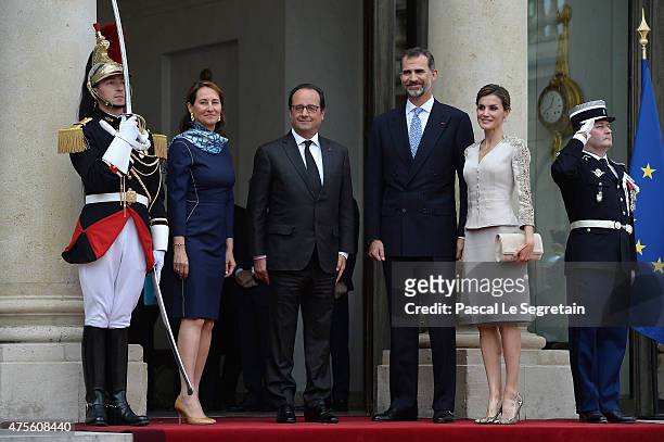 French Minister of Ecology Segolene Royal and French President Francois Hollande pose with King Felipe VI of Spain and Queen Letizia of Spain in the...