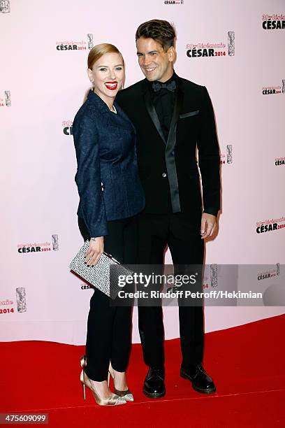 Actress Scarlett Johansson and Romain Dauriac arrive for the 39th Cesar Film Awards 2014 at Theatre du Chatelet on February 28, 2014 in Paris, France.