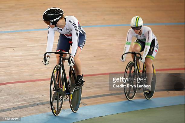Jessica Varnish of Great Britain rides against Anna Meares of Australia in the 1/8 round of the Women's Sprint during day three of the 2014 UCI Track...