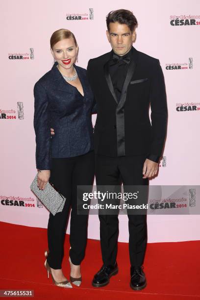 Scarlett Johansson and Romain Dauriac arrive for the 39th Cesar Film Awards 2014 at Theatre du Chatelet on February 28, 2014 in Paris, France.