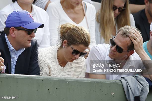 Mirka Federer, the wife of Switzerland's Roger Federer and his coach Stefan Edberg attend his men's quarter final match against Switzerland's...