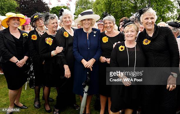 Camilla, Duchess of Cornwall poses for a photo with the Calendar Girls Moyra Livesey, Beryl Bamforth, Christine Clancy, Lynda Logan, Duchess, Angela...
