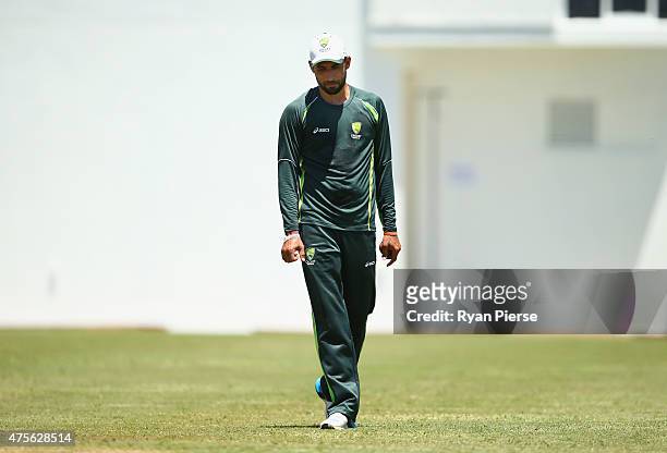 Fawad Ahmed of Australia reacts after speaking to Australian Selector Mark Waugh during an Australian nets session at Windsor Park on June 2, 2015 in...