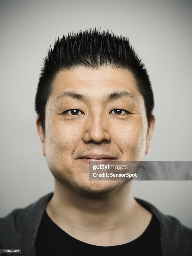 Portrait of a young japanese man with happy expression