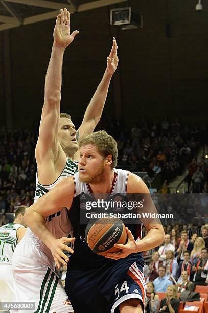 John Bryant, #54 of FC Bayern Munich in action during the 2013-2014 Turkish Airlines Euroleague Top 16 Date 8 game between FC Bayern Munich v...