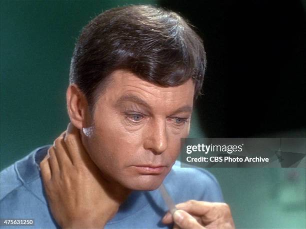 DeForest Kelley as Dr. Bones McCoy being threatened by Khan on the Star Trek: The Original Series episode "Space Seed." Original air date February...