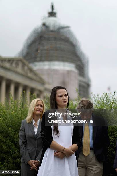 Angelina Sujata, who was injured three years ago by a defective Takata airbag, joins members of Congress for a news conference outside the U.S....