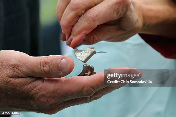 Rep. Jan Schakowsky and Rep. Frank Pallone hold pieces of metal schrapnel from a defective Takata airbag during a news conference outside the U.S....