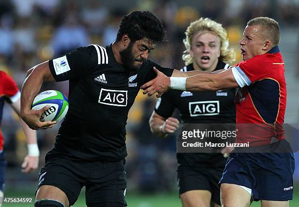 Akira Ioane of New Zealand competes with Ben Vellacott of Scotland during the World Rugby U20 Championship 2015 match New Zealand and Scotland...