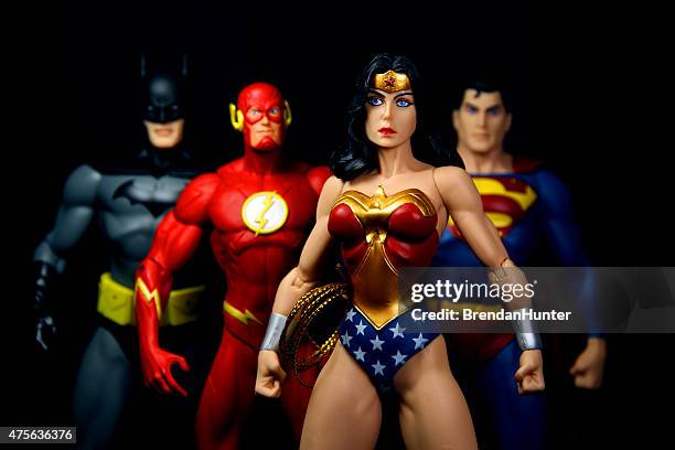 strong woman - action figures stock pictures, royalty-free photos & images