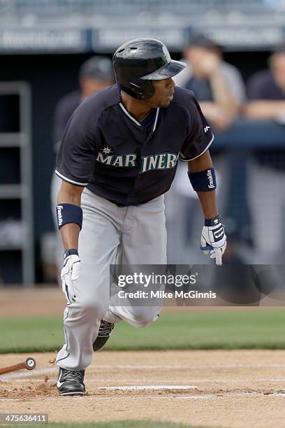 Endy Chavez of the Seattle Mariners hits a single in the top of the first inning against the San Diego Padres during a Spring Training game at Peoria...