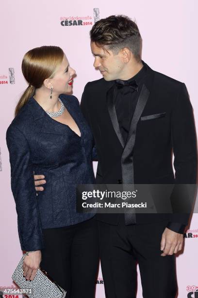 Scarlett Johansson and Romain Dauriac arrive for the 39th Cesar Film Awards 2014 at Theatre du Chatelet on February 28, 2014 in Paris, France.