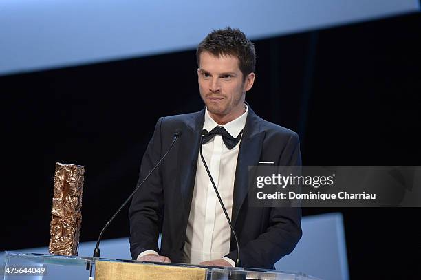 Actor Pierre Deladonchamps is awarded Most Promising Actor for 'Stranger by the Lake' on stage during the 39th Cesar Film Awards 2014 at Theatre du...