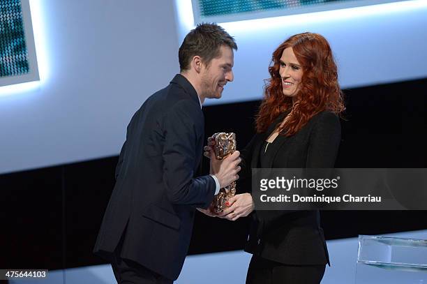 Audrey Fleurot presents actor Pierre Deladonchamps with the Most Promising Actor for 'Stranger by the Lake' award on stage during the 39th Cesar Film...