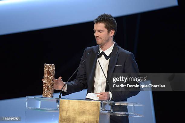 Actor Pierre Deladonchamps is awarded Most Promising Actor for 'Stranger by the Lake' on stage during the 39th Cesar Film Awards 2014 at Theatre du...