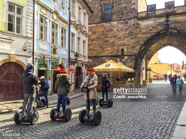 tourists in prague, czech republic - segway stockfoto's en -beelden