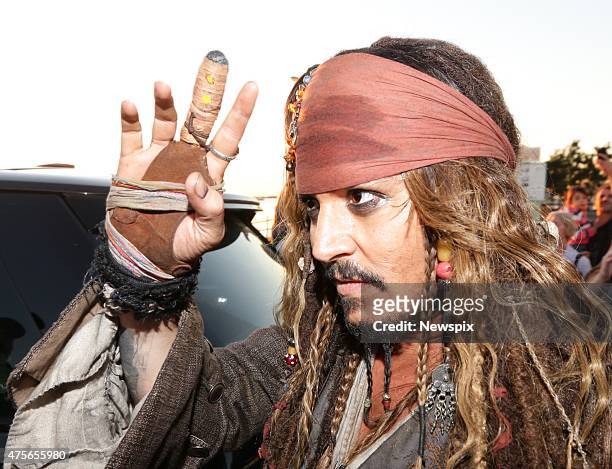 American actor Johnny Depp, dressed as 'Captain Jack Sparrow', greets locals at Cleveland in Redland City, Queensland, after a day of filming...