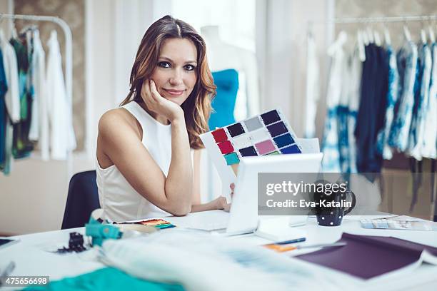 fashion designer is in her office - millionaire drawing stock pictures, royalty-free photos & images