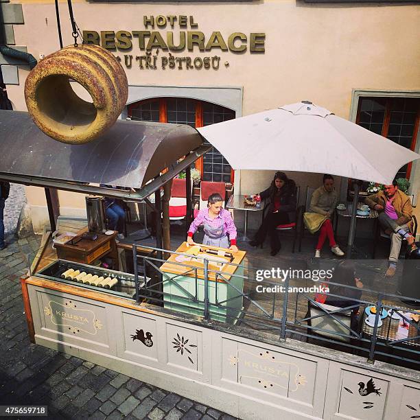 people eating in prague cafe - trdelník stock pictures, royalty-free photos & images