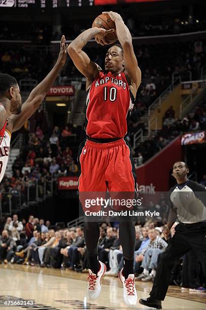 DeMar DeRozan of the Toronto Raptors shoots against the Cleveland Cavaliers at The Quicken Loans Arena on February 25, 2014 in Cleveland, Ohio. NOTE...