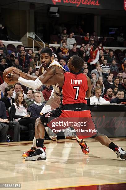 Kyrie Irving of the Cleveland Cavaliers drives to the hoop against Kyle Lowry of the Toronto Raptors at The Quicken Loans Arena on February 25, 2014...