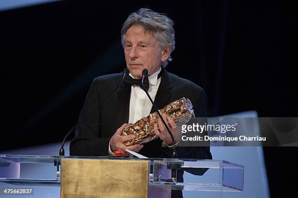 Roman Polanski receives the Best Director award for 'Venus in Fur' on stage during the 39th Cesar Film Awards 2014 at Theatre du Chatelet on February...