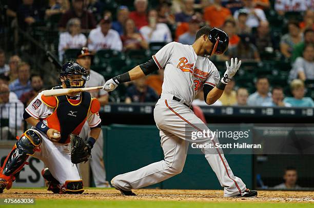 Jimmy Paredes of the Baltimore Orioles strikes out swinging in the ninth inning during their game against the Houston Astros at Minute Maid Park on...